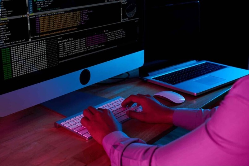 Coding on a desktop computer with multiple screens, showcasing IT training, computer programming, and tech career development at MyComputerCareer.