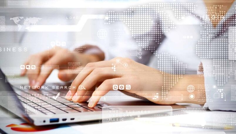 Laptop with digital data overlays representing technology training and IT career skills from MyComputerCareer.