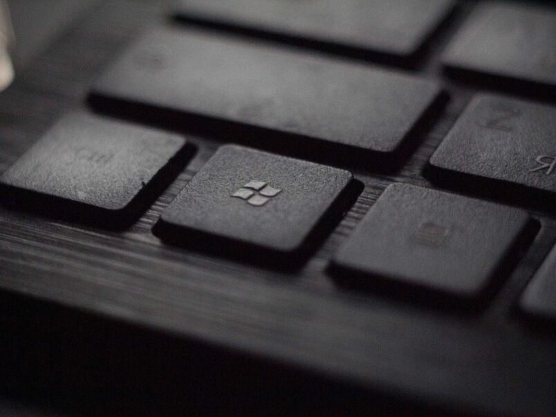 Keyboard with Windows logo key close-up, emphasizing computer skills and IT training.