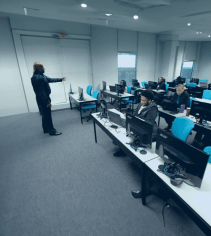 Computer tech training classroom at MyComputerCareer campus, featuring students in hands-on IT and technical courses, focused on preparing for careers in information technology and computer networking.