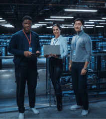 Network engineers working in a data center with servers and technology, demonstrating information technology careers and education for IT professionals at MyComputerCareer.