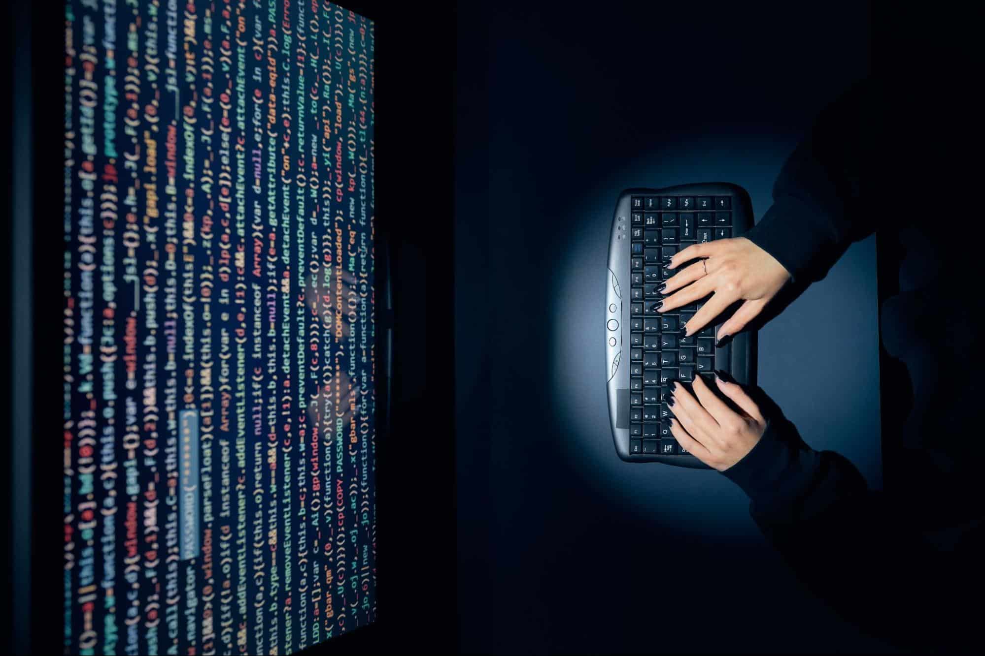 Coding programming language tutorial on computer screen, woman typing code on keyboard, IT education, computer science training, MyComputerCareer, career in tech, learning coding skills.